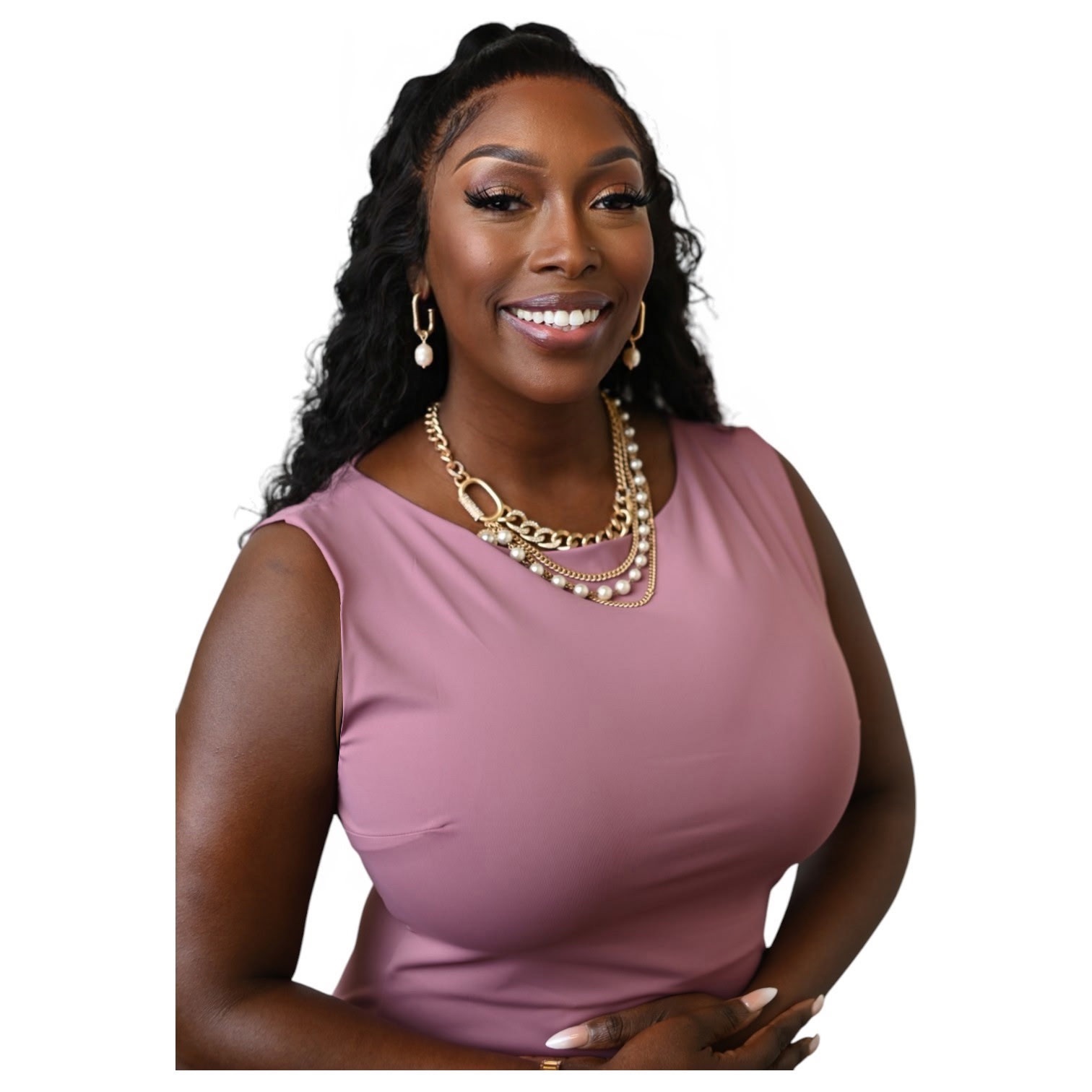 Smiling woman with long curly hair, wearing a pink sleeveless top and gold jewelry, against a white background.