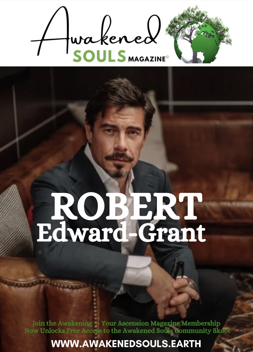 Man with dark hair and mustache in a suit sitting on a leather chair, looking at the camera, in a room with dark walls.