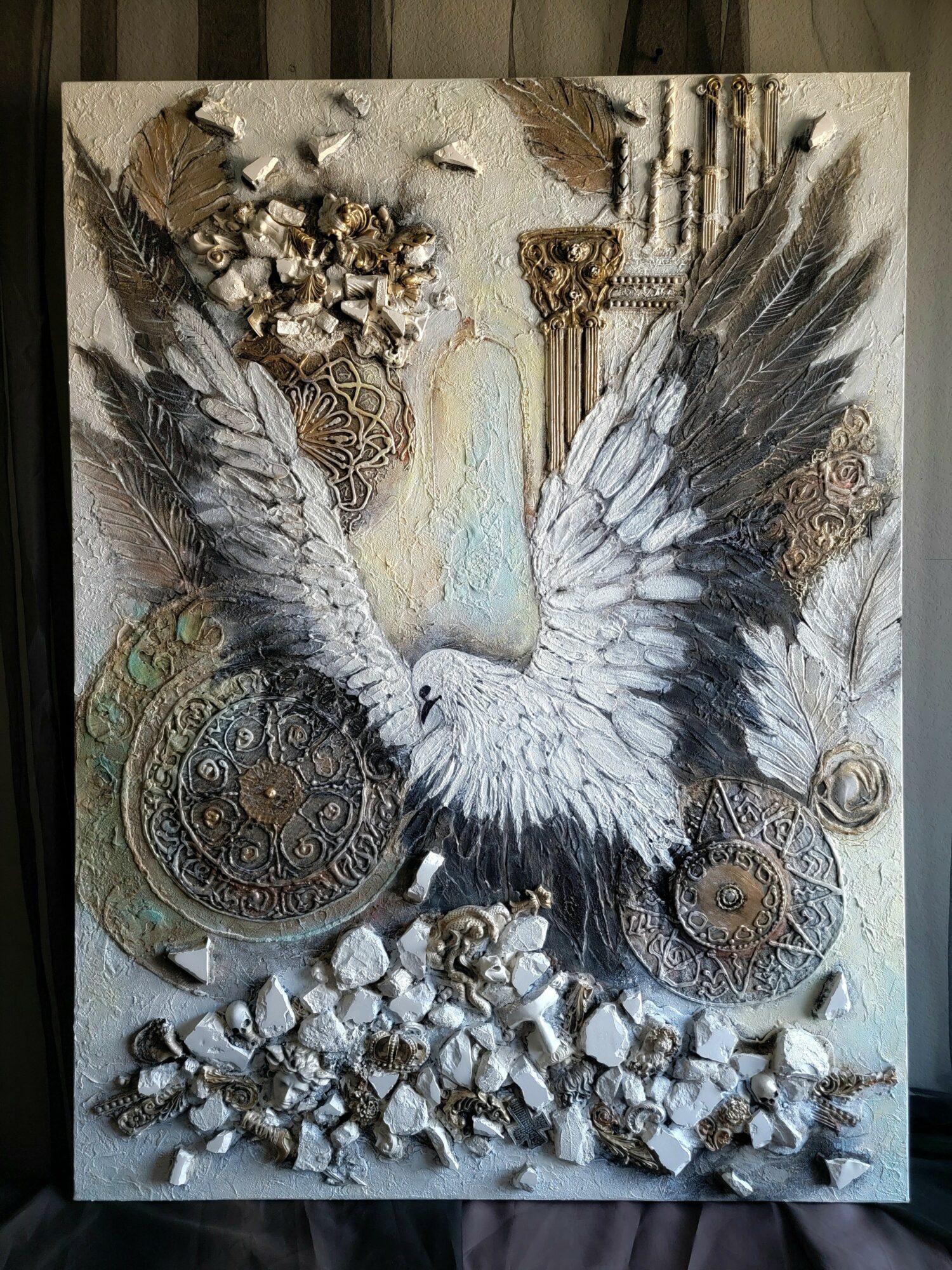 A white bird with outstretched wings is surrounded by gears, feathers, and decorative elements in a mixed-media artwork.