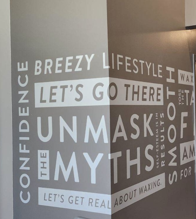 Wall with text about confidence, lifestyle, and myths, including phrases like