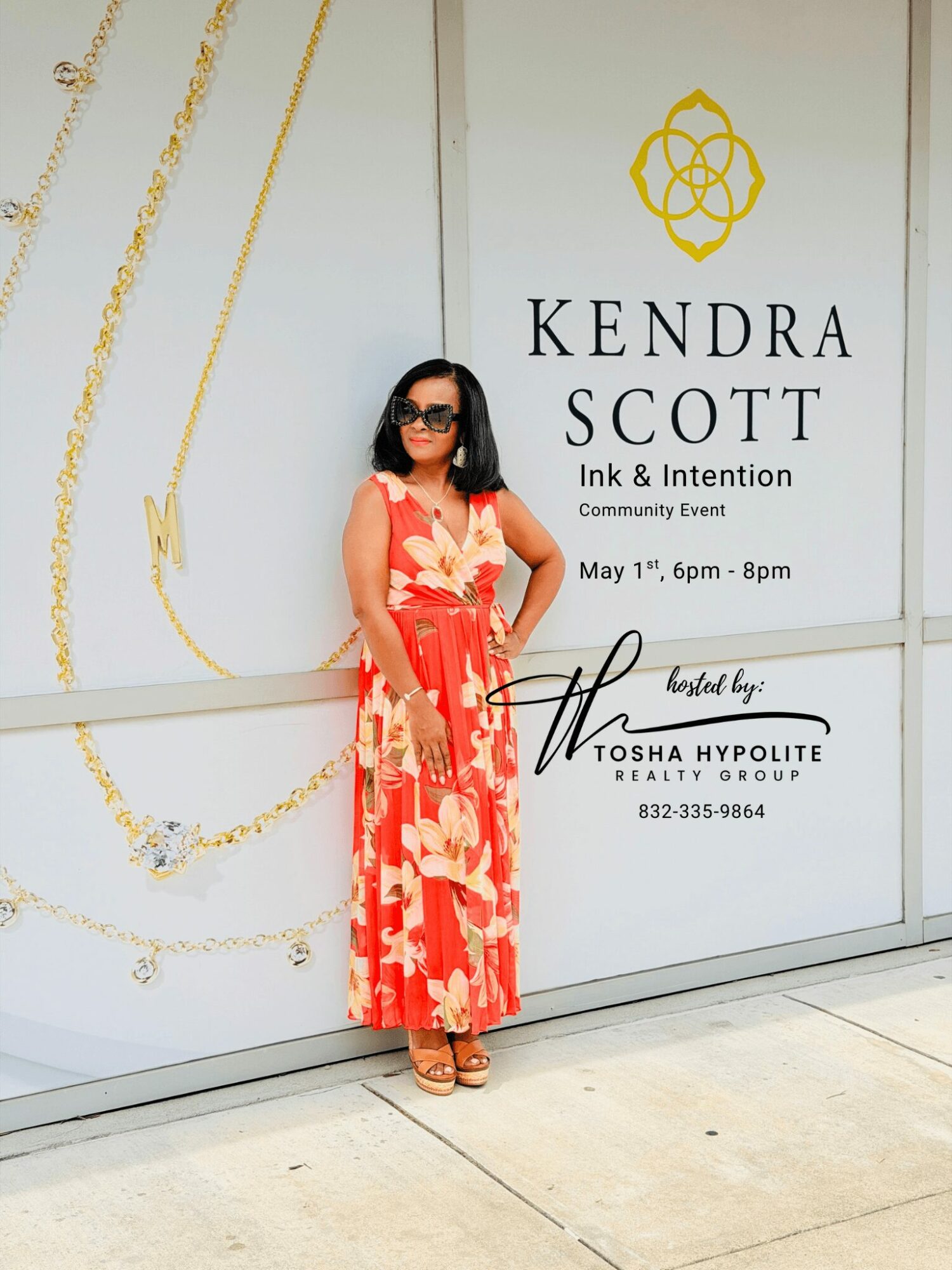 Woman in a red floral dress and sunglasses standing in front of a white wall with event information.