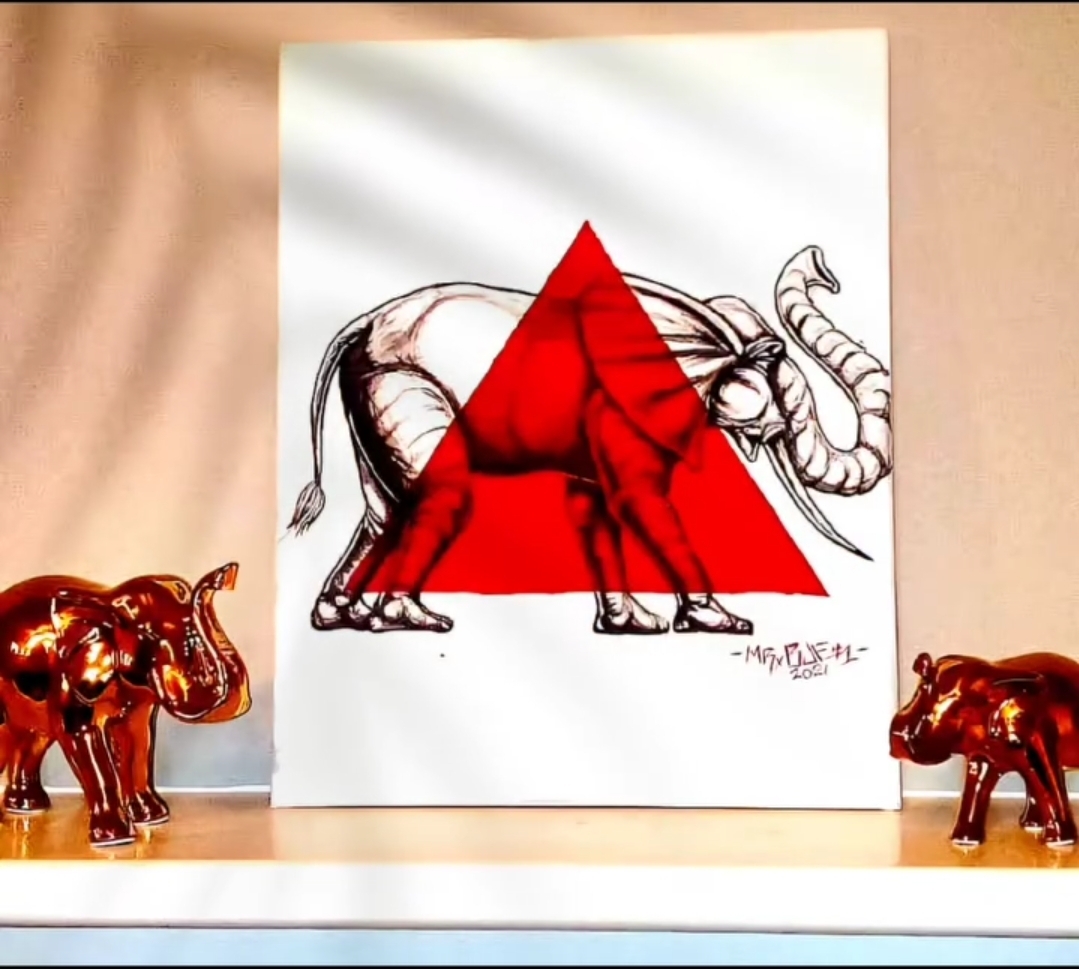 Drawing of an elephant with a red triangle overlay, placed on a wall with decorative elephant figurines on a shelf.