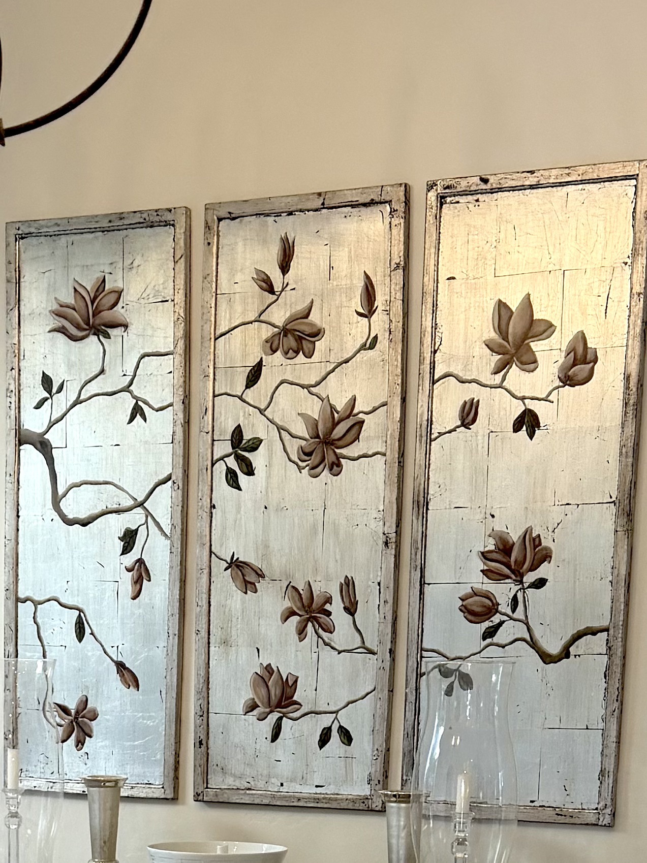 Three vertical wooden panels with floral designs and a distressed white background, arranged side by side.