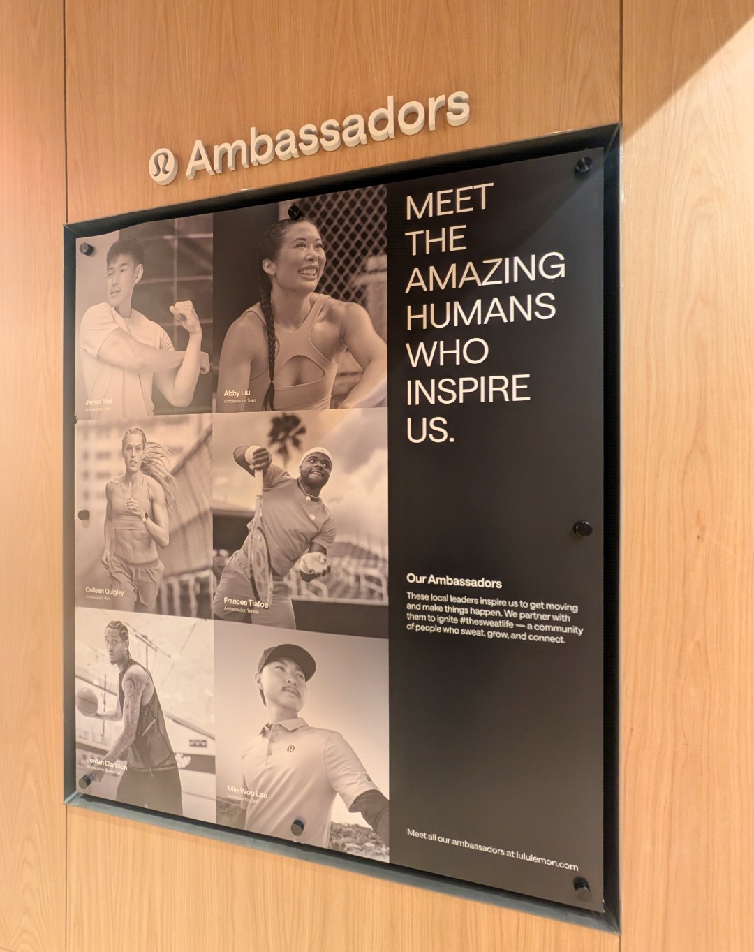 Display board with black and white photos of diverse people, and text reading 'Meet the amazing humans who inspire us.'