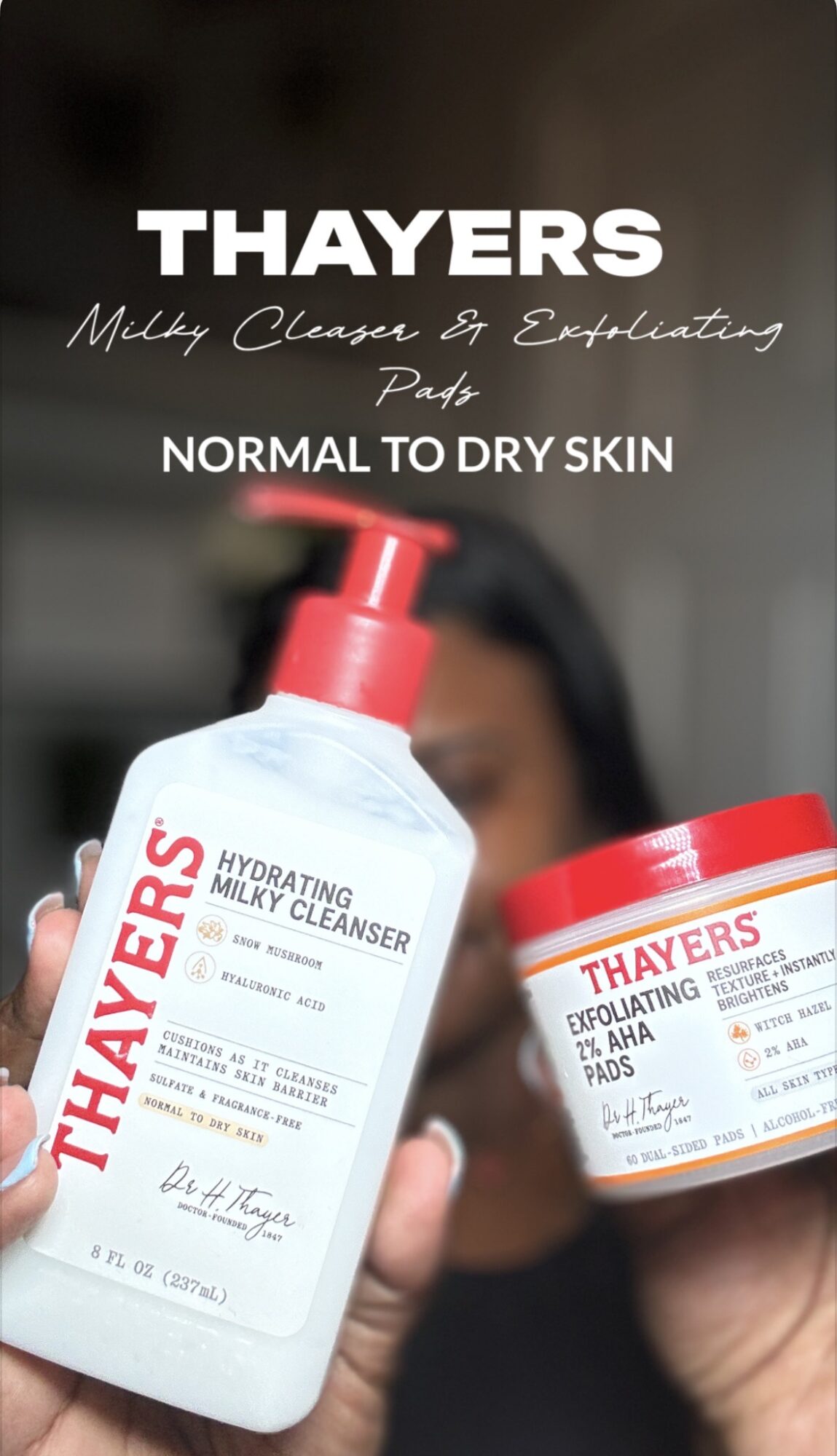 Person holding Thayers skincare products, a bottle of hydrating milk cleanser and a jar of exfoliating pads, with blurred background.