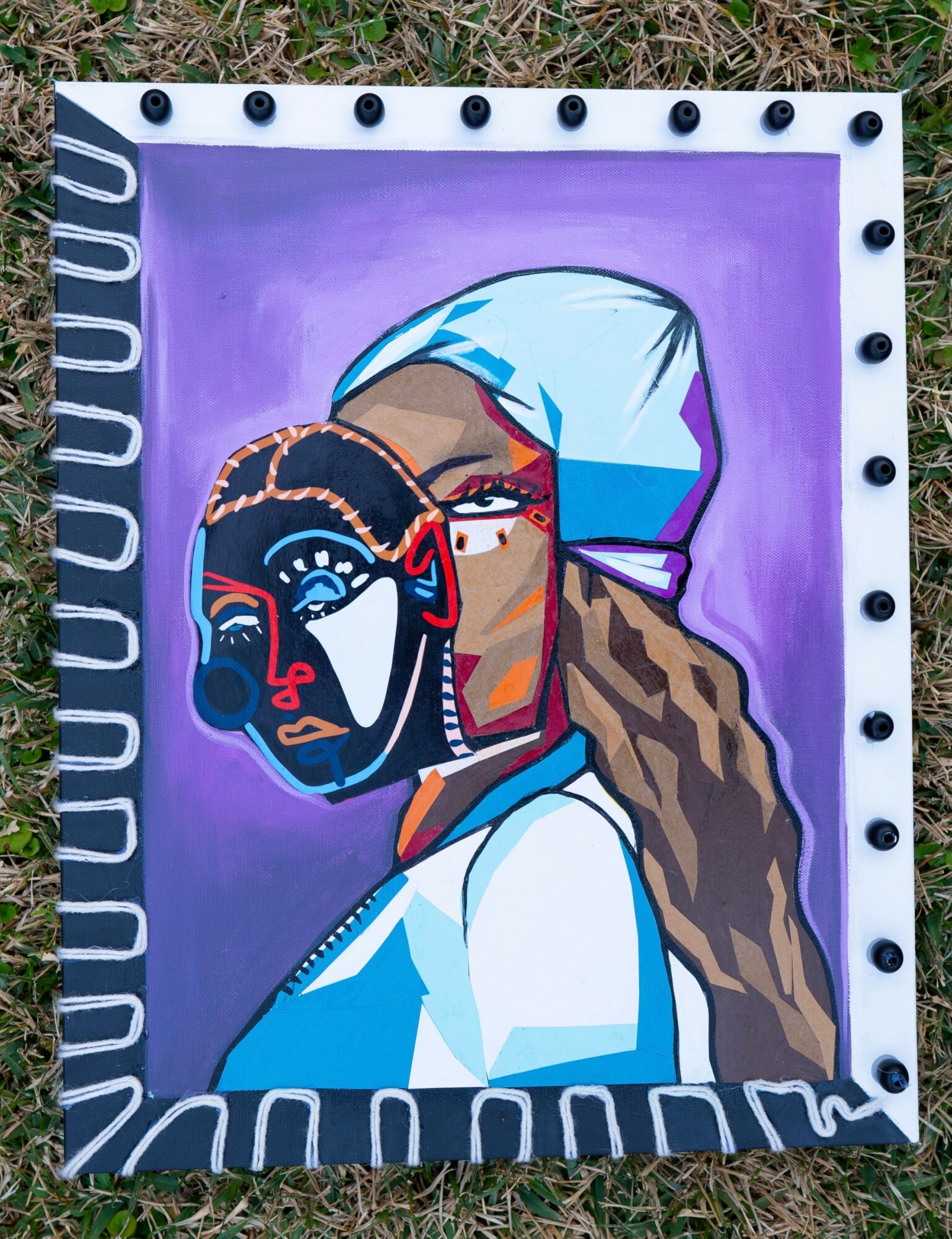 Colorful painting of a woman with long hair and a child, both with stylized features, against a purple background.