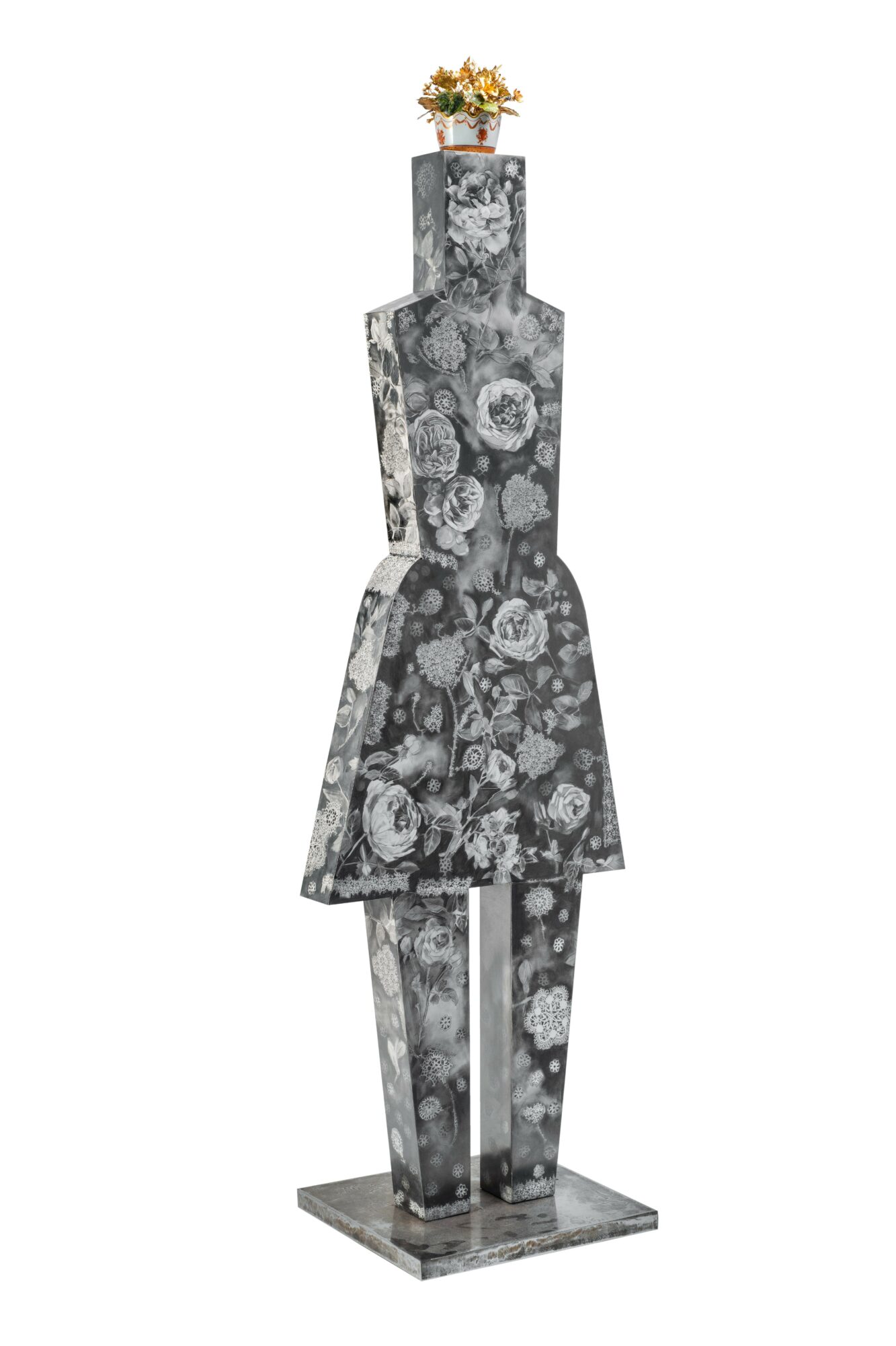 Sculpture of a woman with a flower pot on her head, decorated with floral patterns, standing on a base.