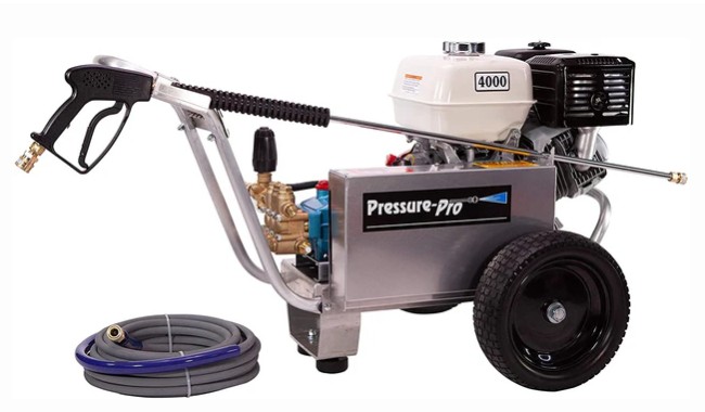 Pressure washer with a spray gun, hose, and engine, mounted on wheels for mobility.