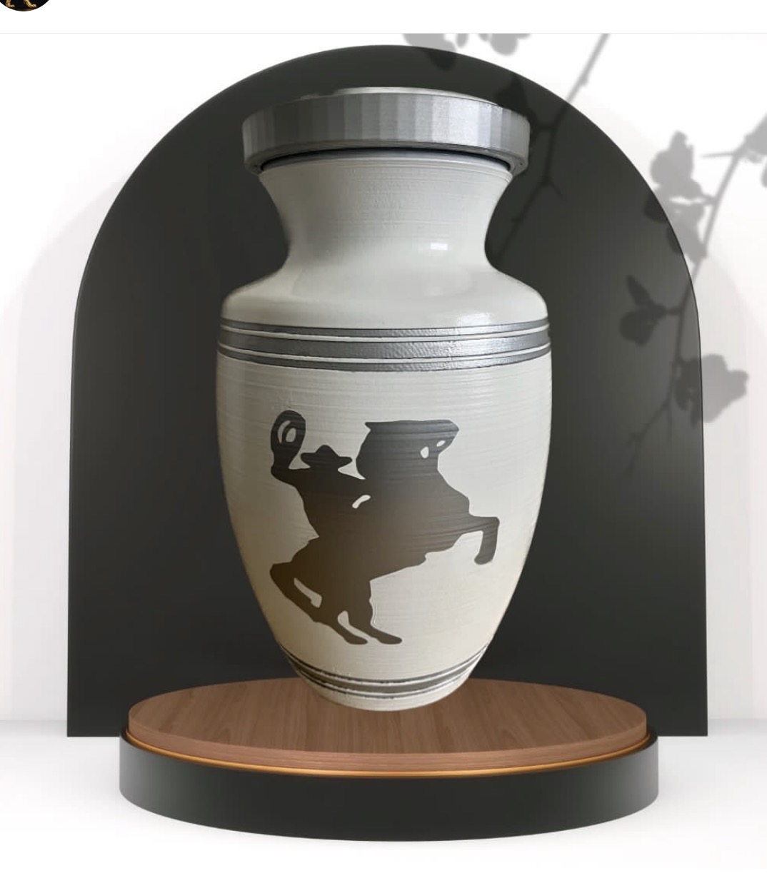 Decorative vase with black silhouette of a person riding a horse, displayed on a wooden platform inside a niche.