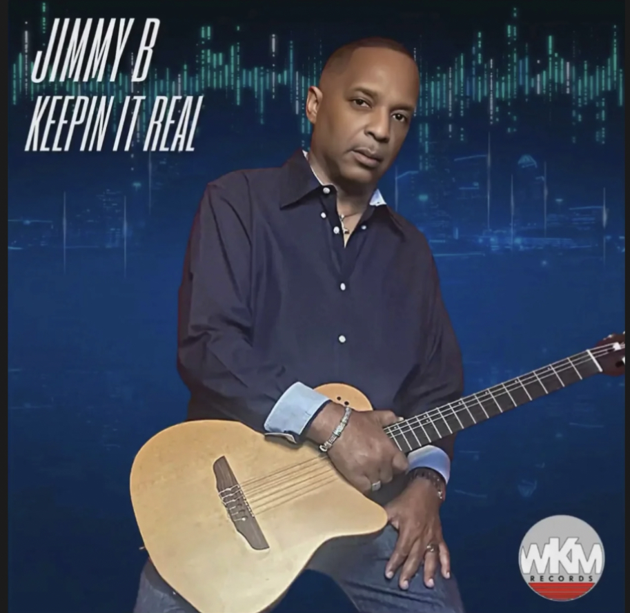 Man holding an acoustic guitar, wearing a dark shirt, with a digital soundwave background, album title, and logo.