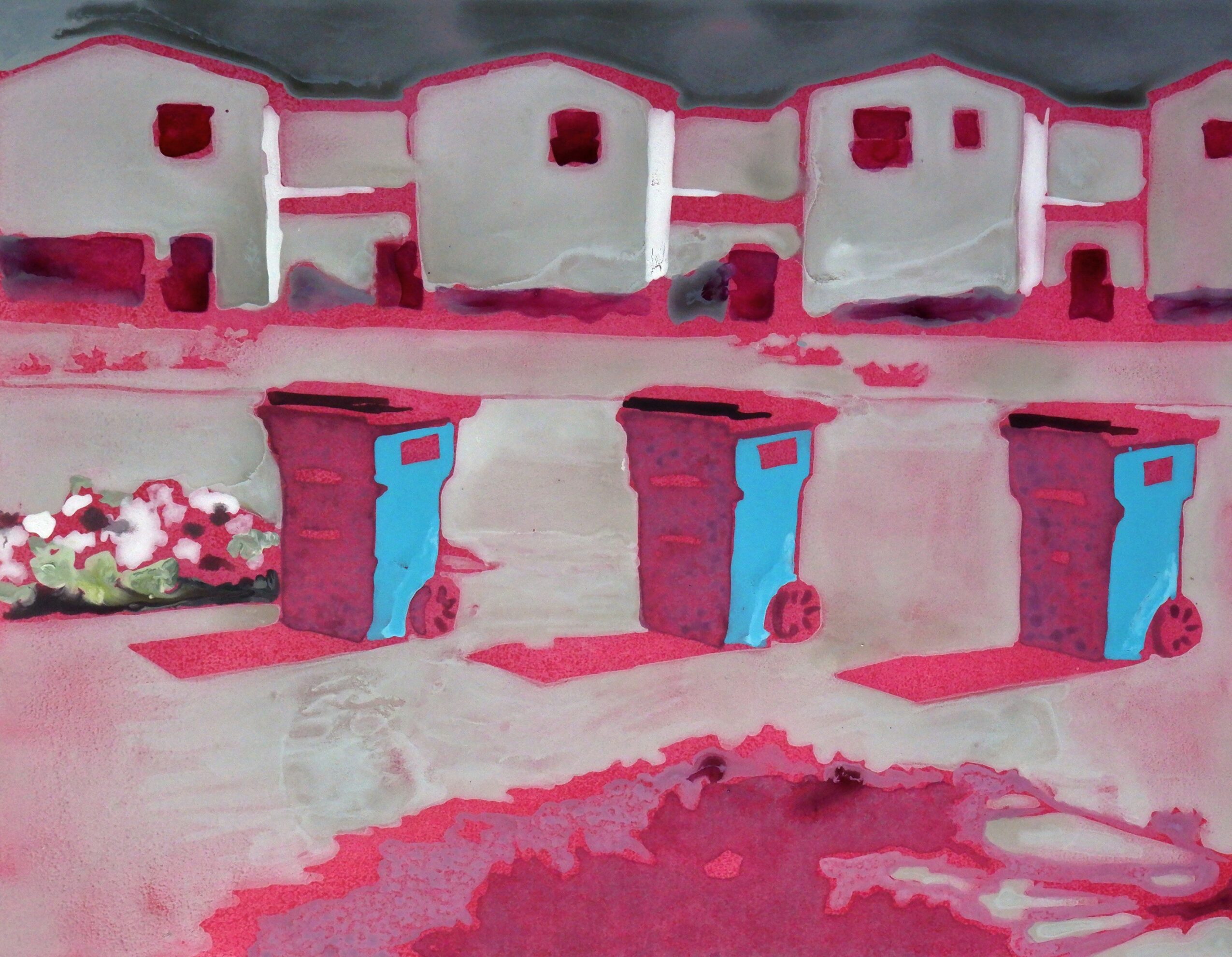 Colorful row of small buildings with blue doors, pink and white tones, and a flower bed on the left.