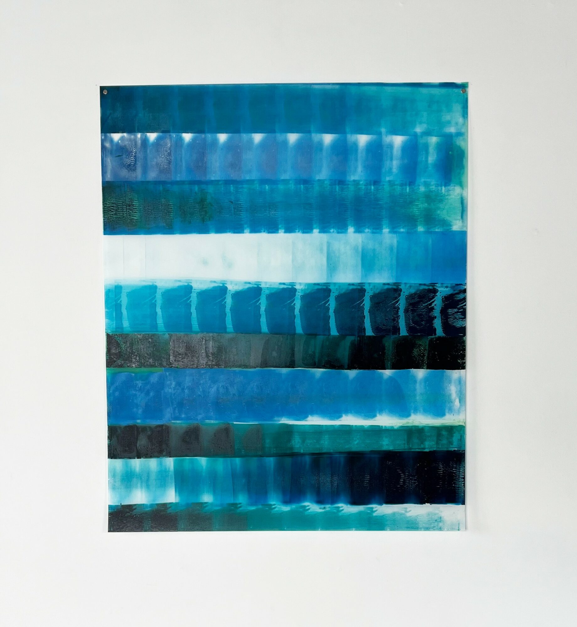 Abstract artwork with horizontal blue and green brushstrokes on a white background.
