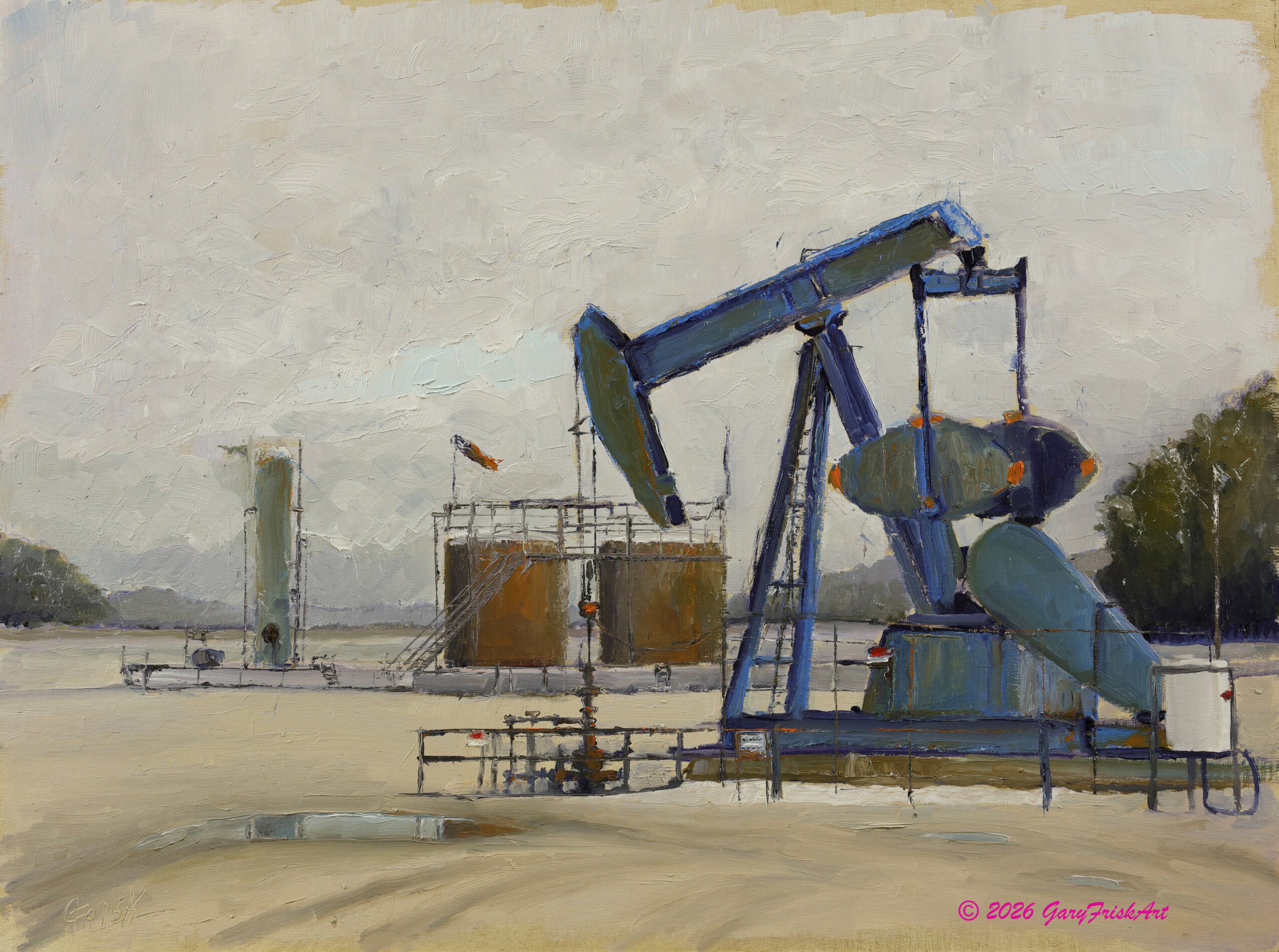 Oil pump jack in an industrial area with tanks and a cloudy sky, surrounded by a fence and some trees.
