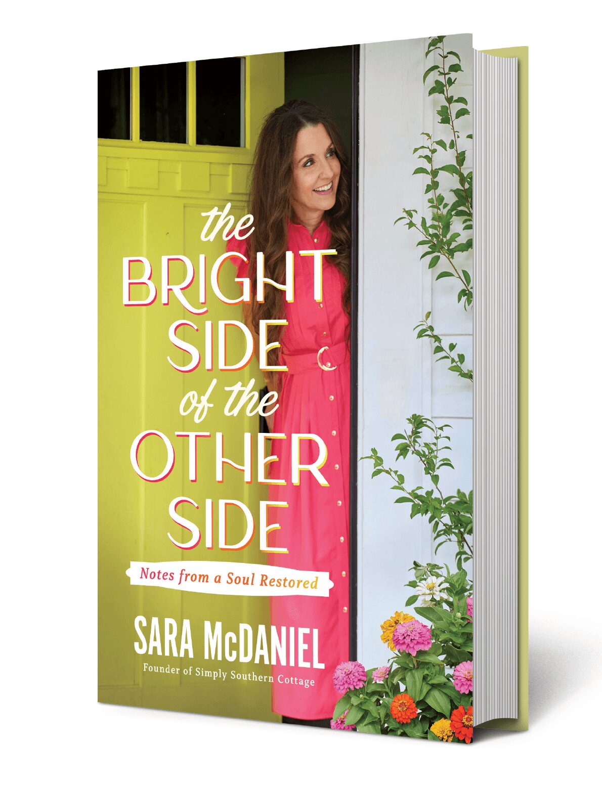 Book cover with a smiling woman in a pink dress standing near a green door and white wall with plants, title and author text.