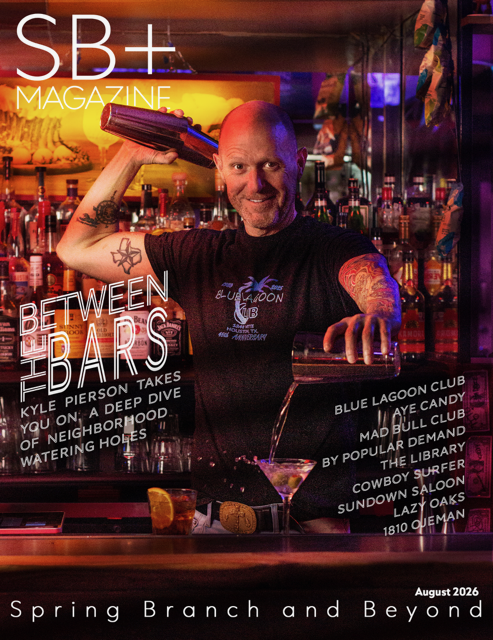 Man behind bar smiling, holding a book, colorful bar background, drinks on counter, neon lights, magazine cover, August 2026.