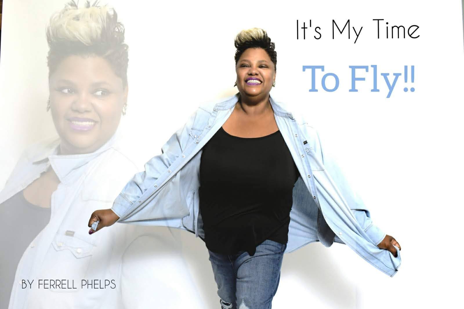 Woman smiling with arms outstretched, wearing a denim jacket and black shirt, with text about flying.