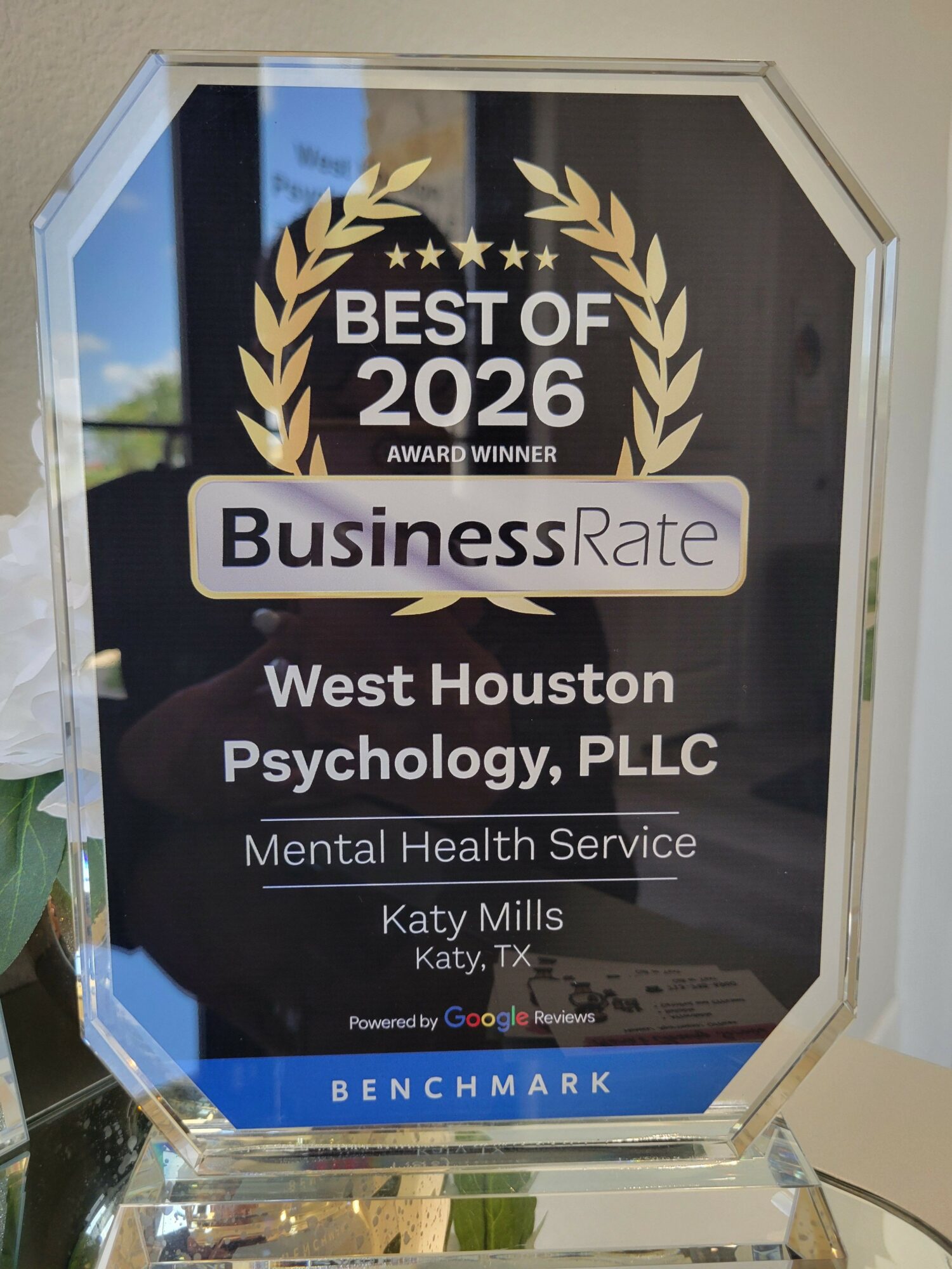 Award plaque for West Houston Psychology PLLC, best business 2026, with a gold laurel wreath and blue background.