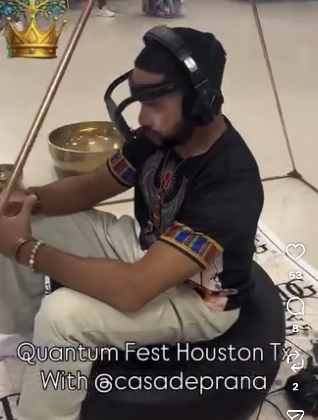 Person wearing headphones and sunglasses, sitting cross-legged, with a bowl nearby, at Quantum Fest Houston Texas, with text overlay.