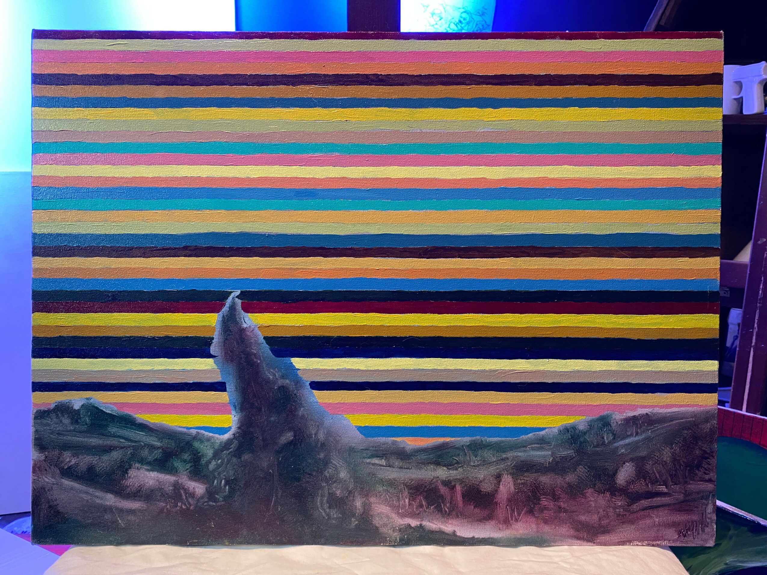 Colorful striped background with a mountain-like formation in the foreground.