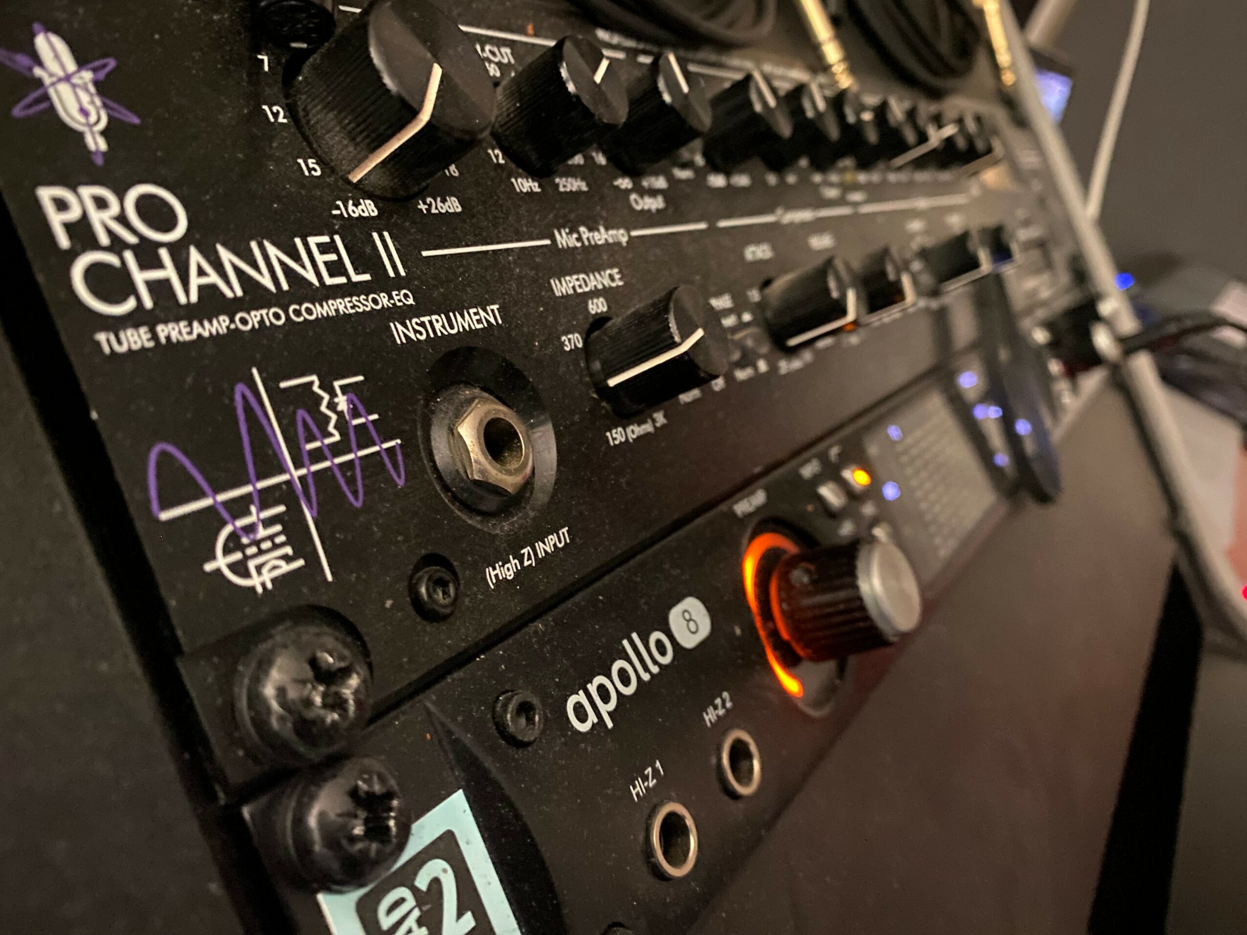 Close-up of a DJ controller with knobs, buttons, and input ports, labeled 'Pro Channel II' and 'Apollo,' on a black surface.