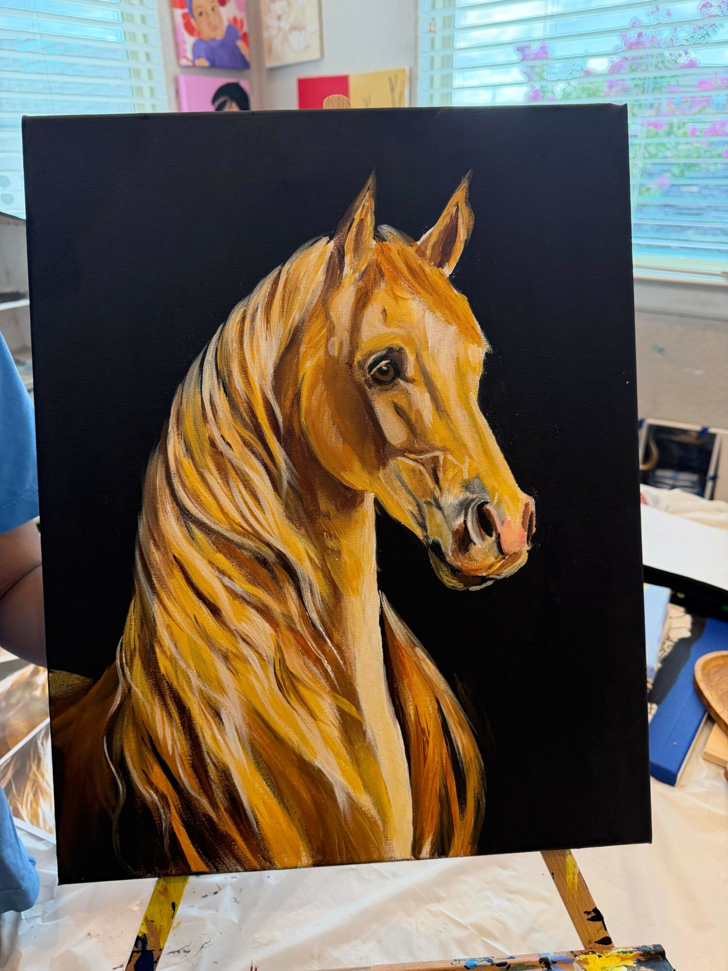 Painting of a horse's head and neck on a black background, with visible brushstrokes and detailed features.