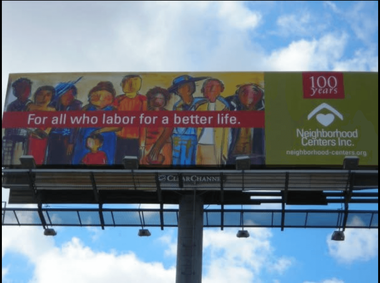 Billboard with colorful illustrations of workers, red banner with white text, blue sky background, and green section with logos.