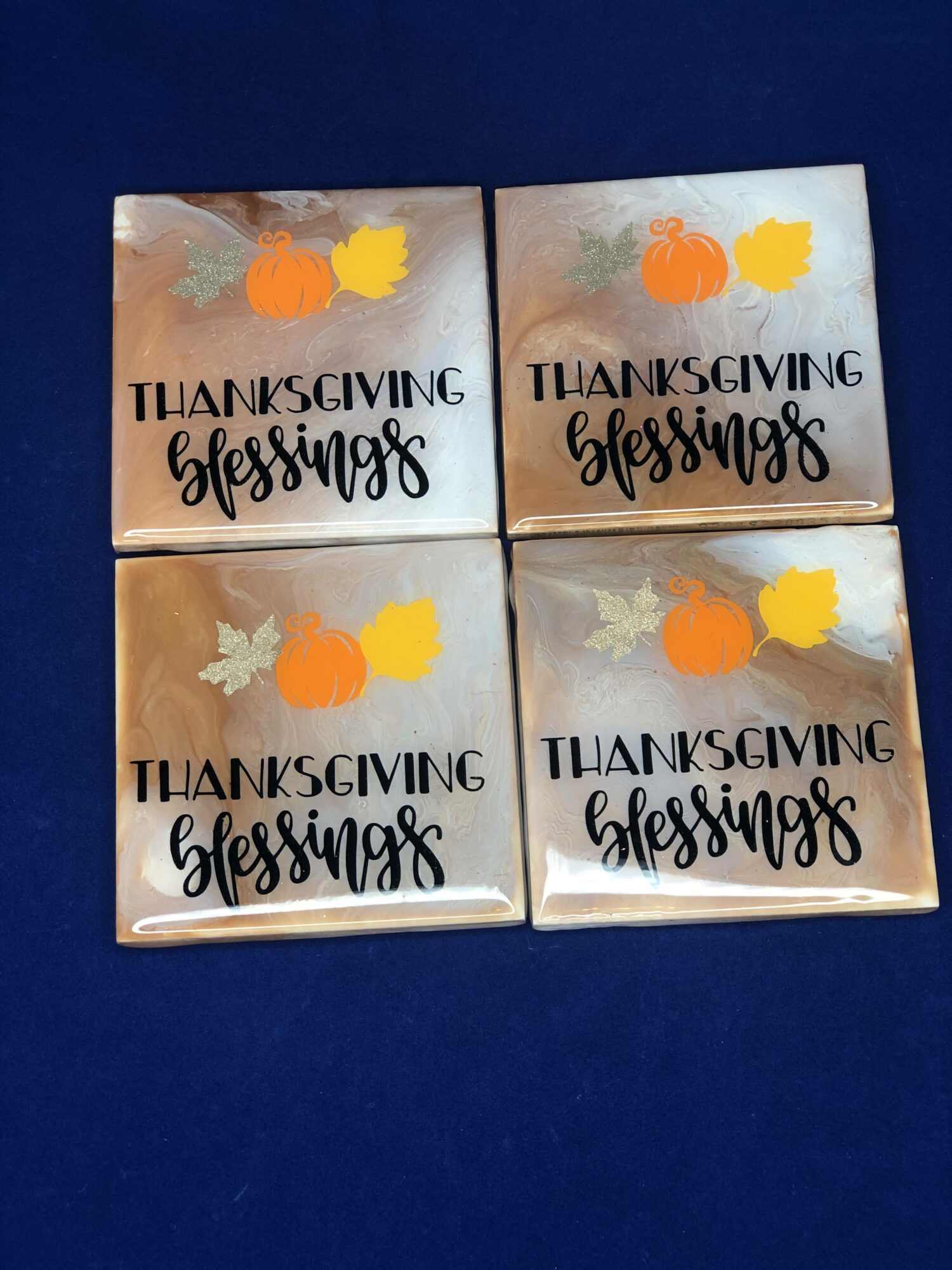 Four small square Thanksgiving-themed cards with pumpkins, leaves, and the words 'Thanksgiving blessings' on a dark blue background.