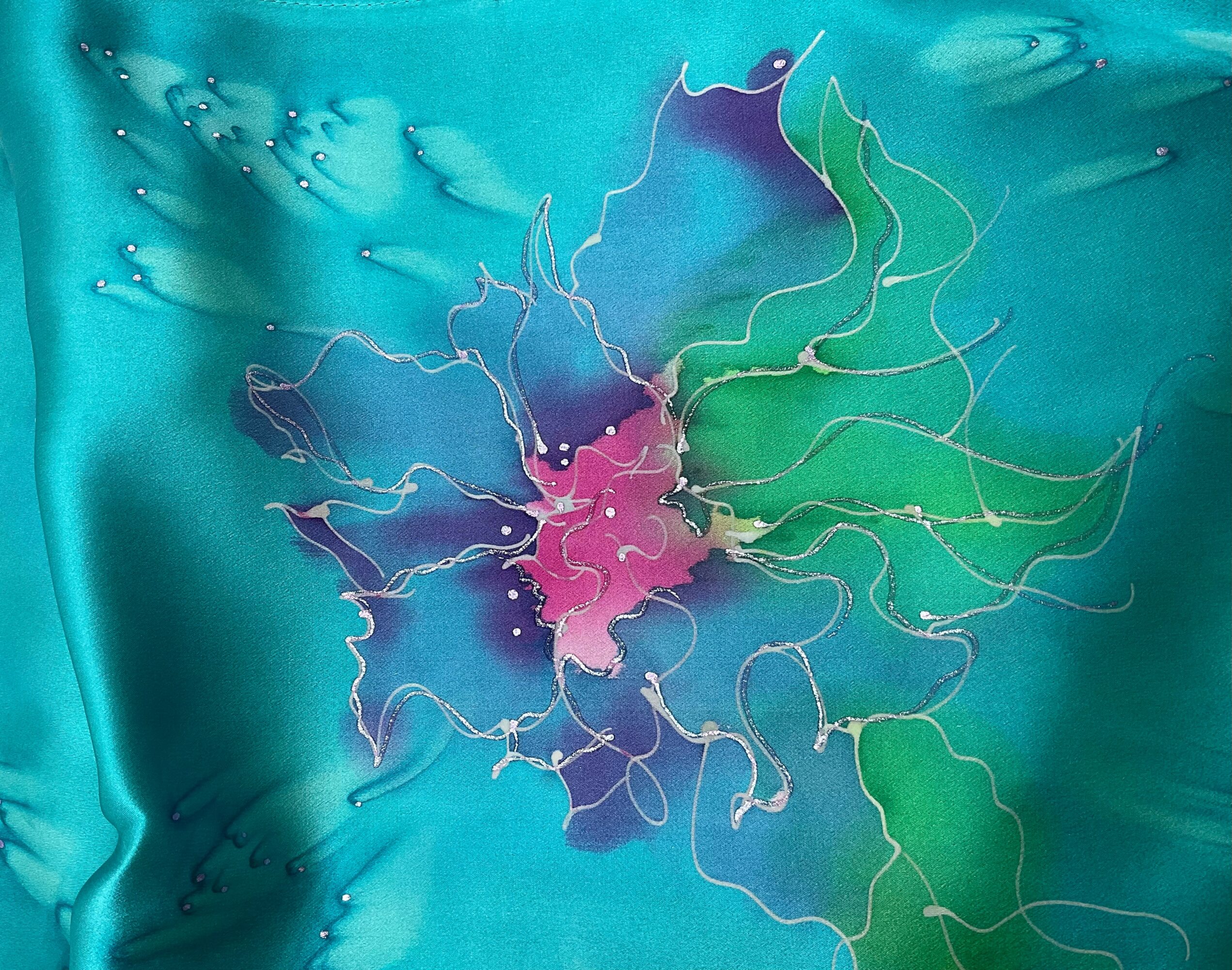 Abstract colorful design with flowing lines and shapes on a teal background.