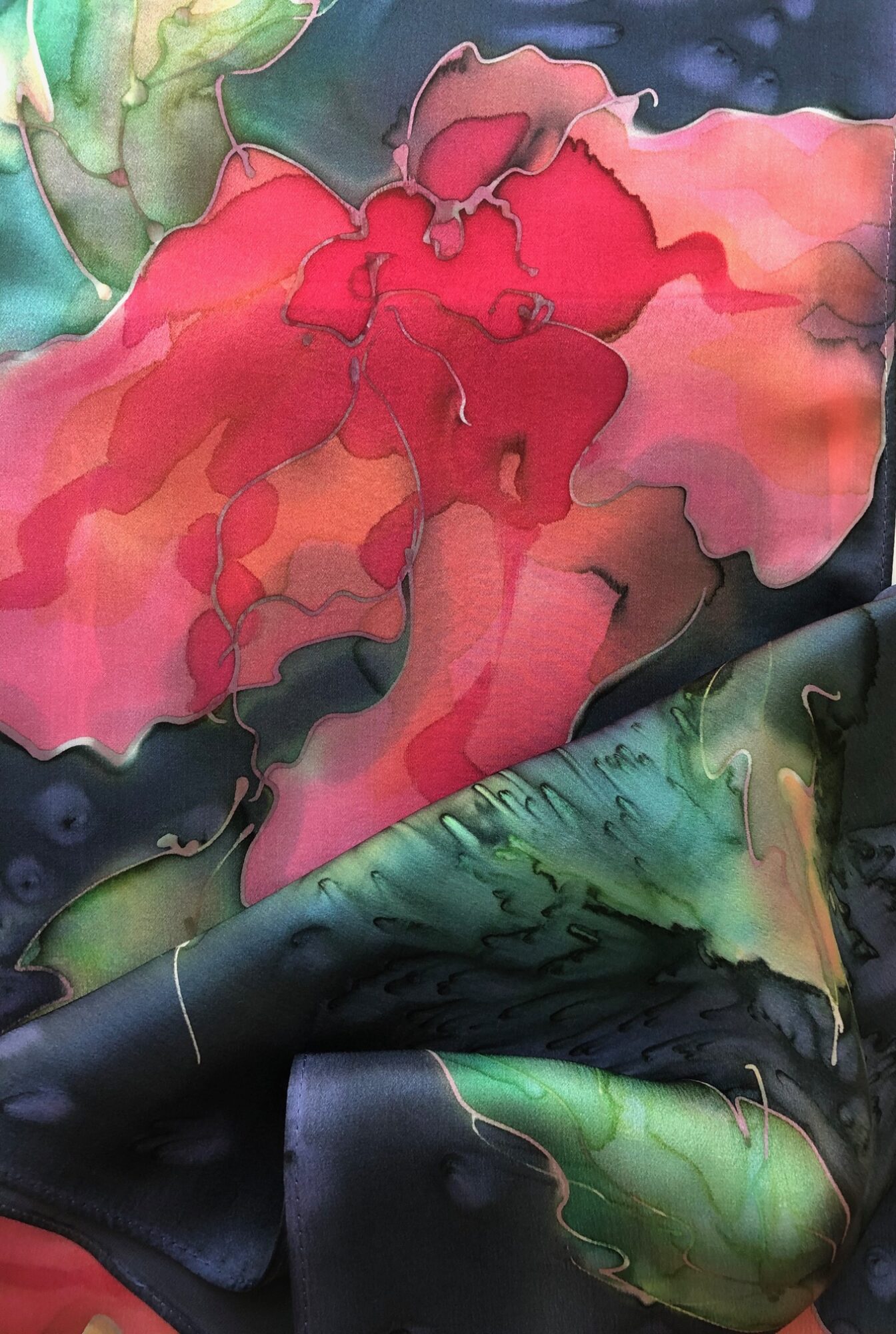 Abstract watercolor painting with pink, red, green, and black colors blending together.
