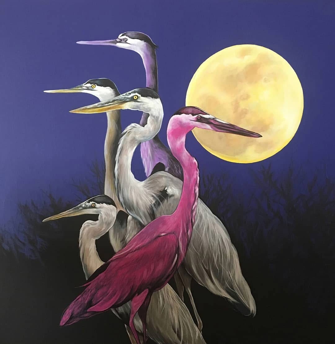 Four herons, one pink, three gray, stand against a dark night sky with a full moon, silhouetted trees in background.