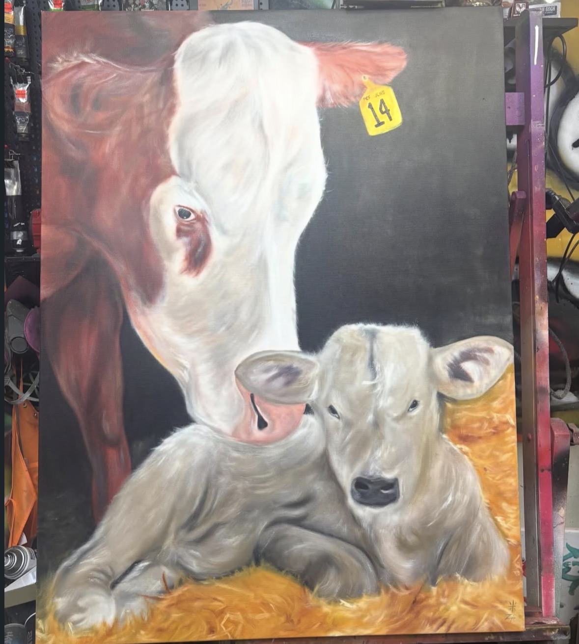 Painting of a cow and a calf lying on hay, with a black background and a yellow price tag, 20 words.