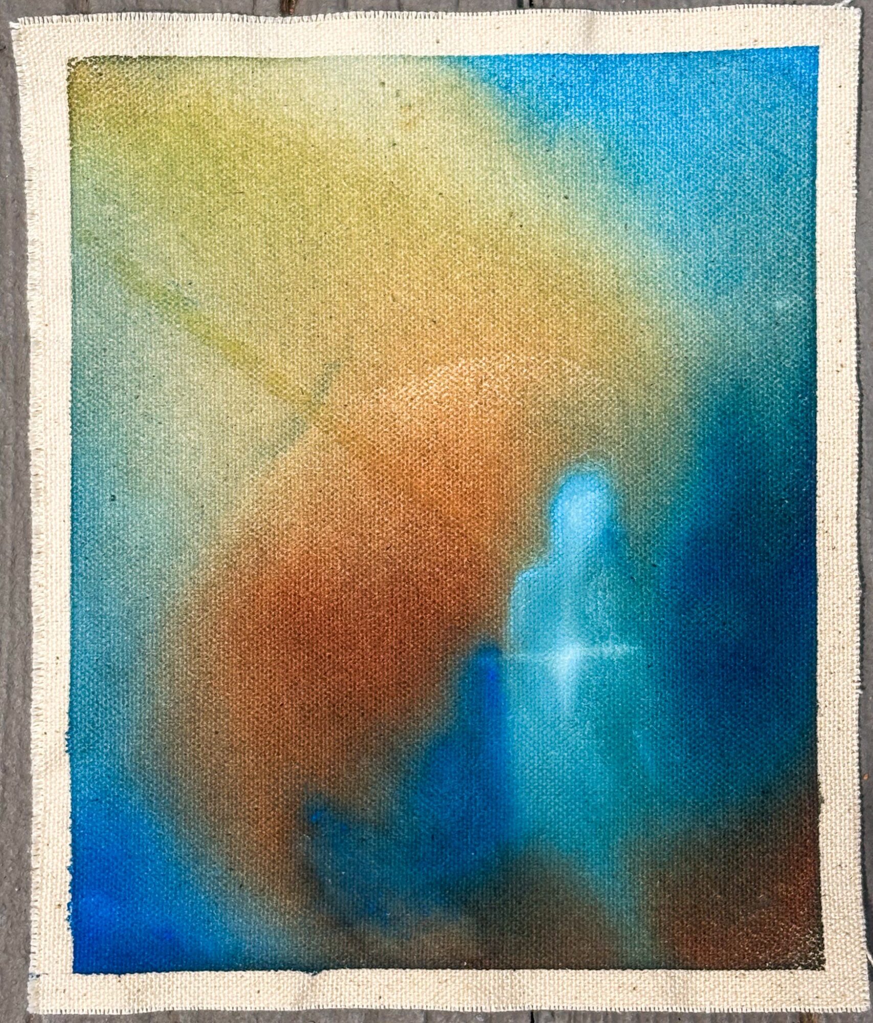 Abstract watercolor painting with blue, green, yellow, and orange colors blending together.