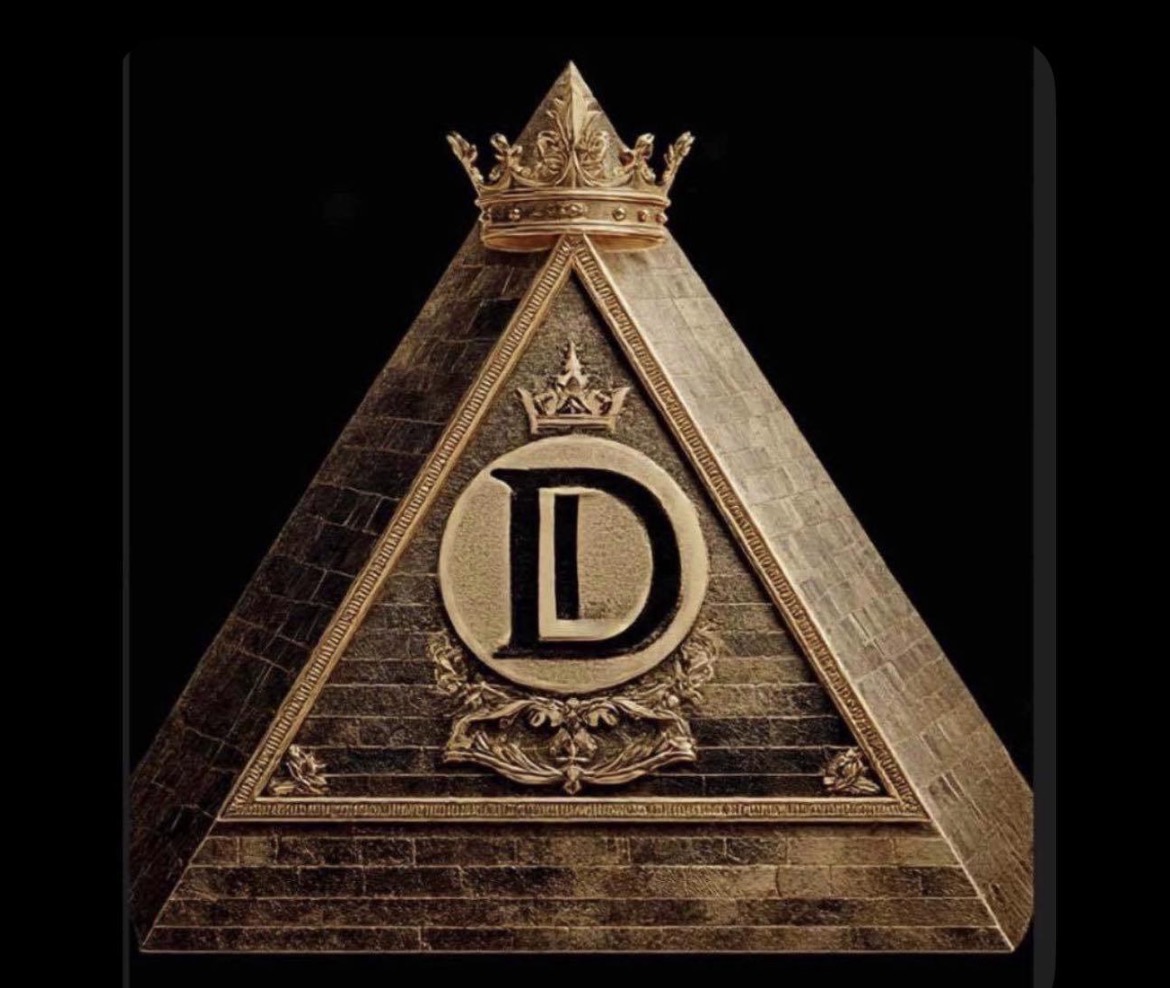 Pyramid-shaped structure with a crown on top, featuring a large letter D inside a circle and decorative elements, against a black background.
