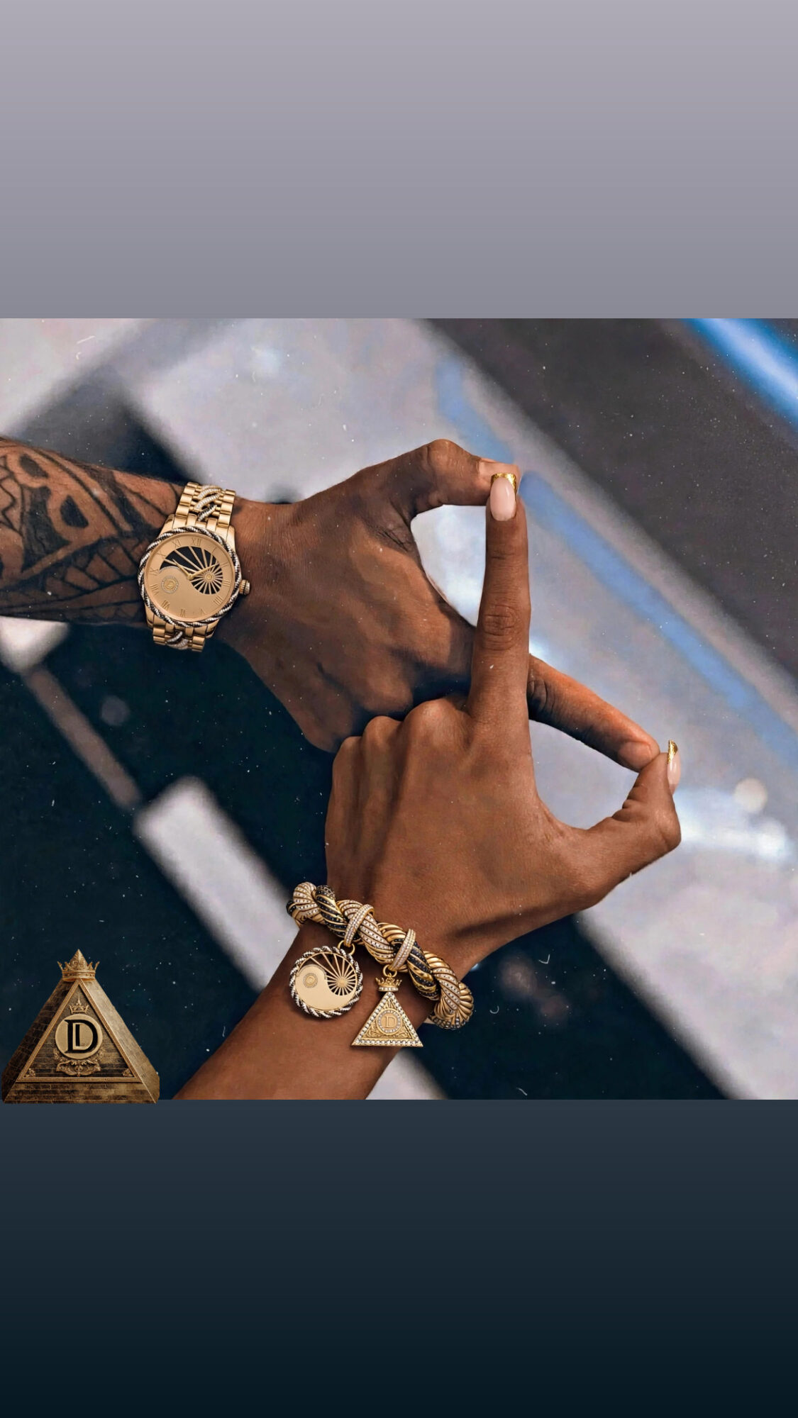 Two hands with jewelry form a heart shape, one with a watch and bracelet, the other with a ring and bracelet.