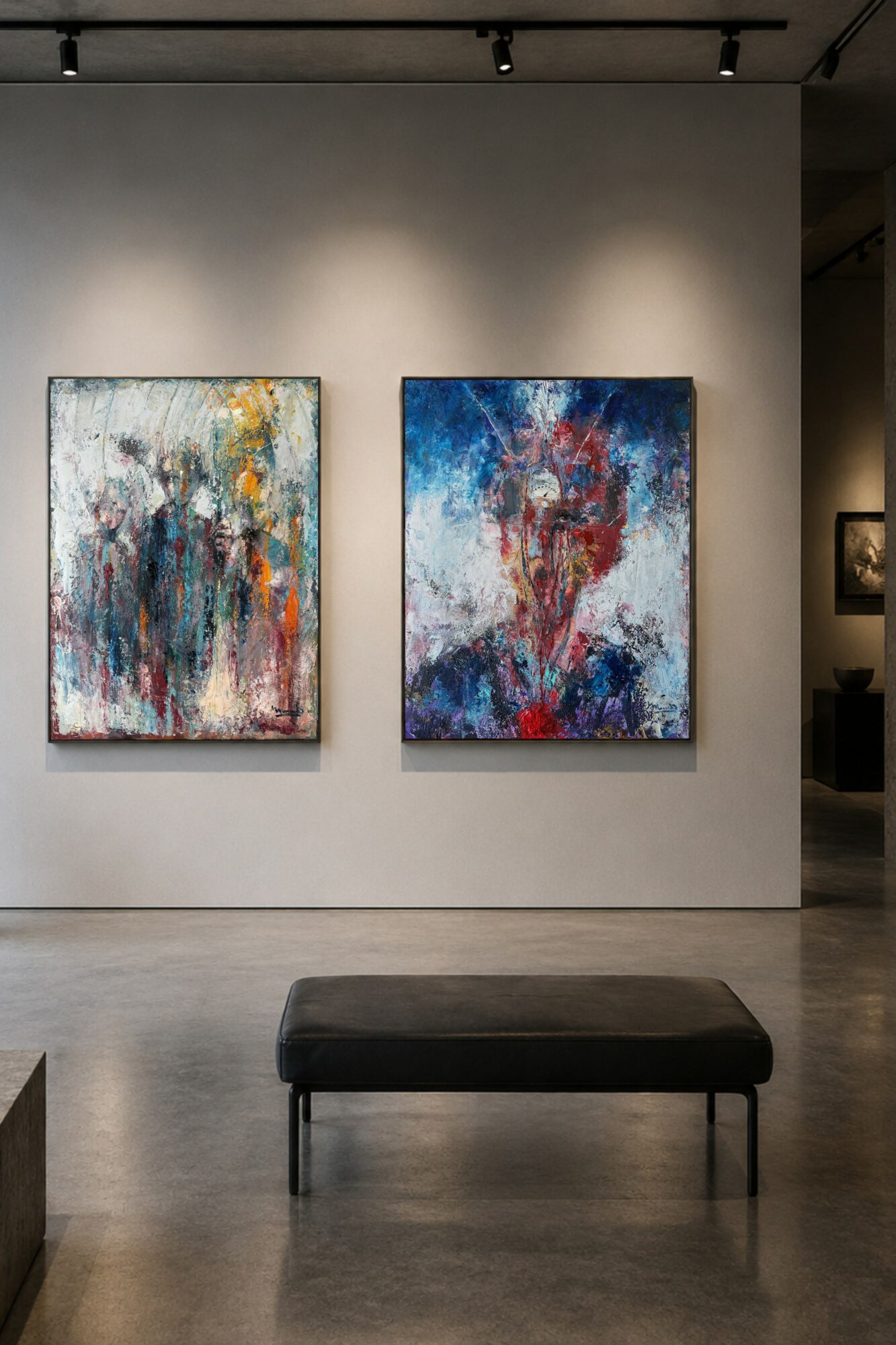 Two abstract paintings hang on a gallery wall, with a black bench in front. The paintings feature colorful, textured brushstrokes.