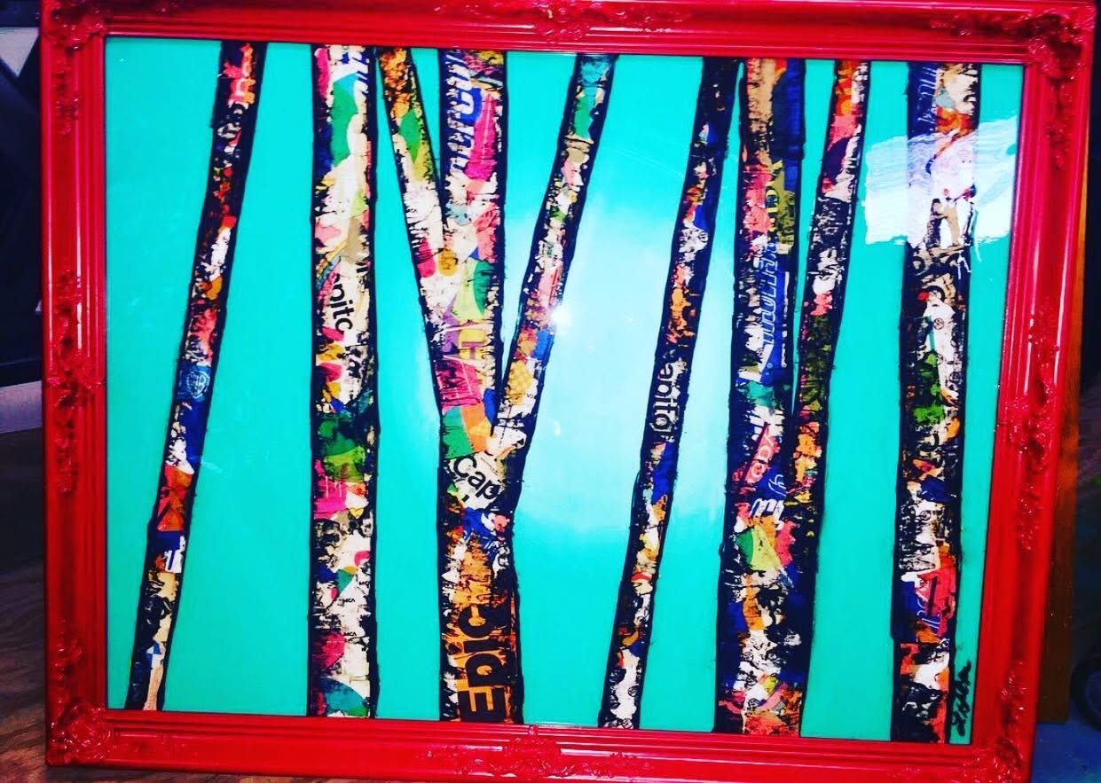 Colorful abstract artwork with vertical striped patterns inside a red frame.