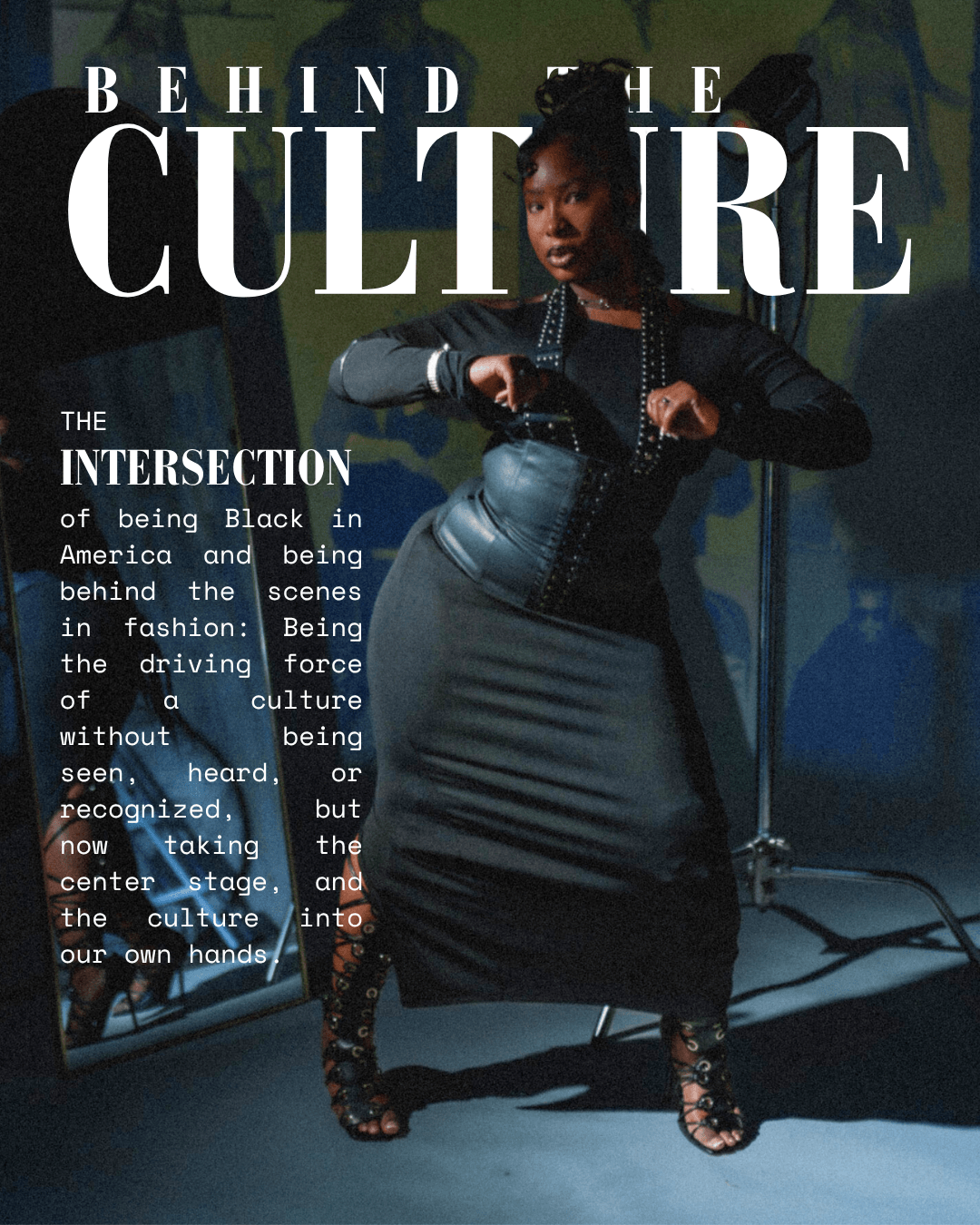 A woman stands in front of a dark background with text reading 'Behind the Culture.' She wears a black jacket and a shiny skirt, with her hands on her hips.