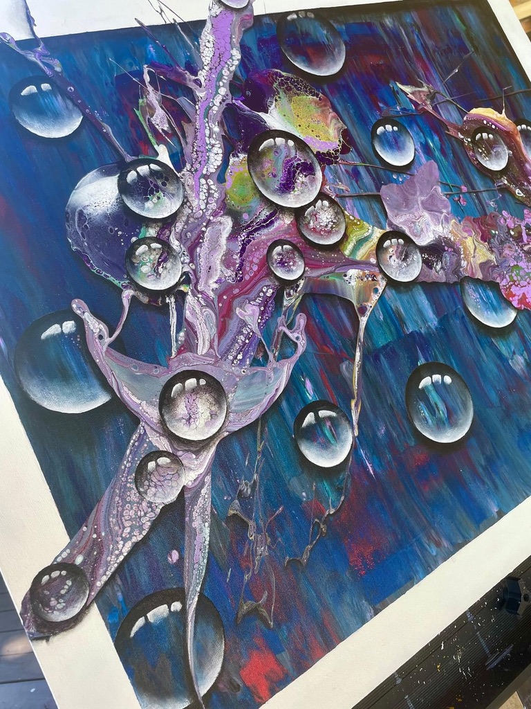 Abstract painting with water droplets and vibrant colors, including purple, blue, and yellow, on a dark background.
