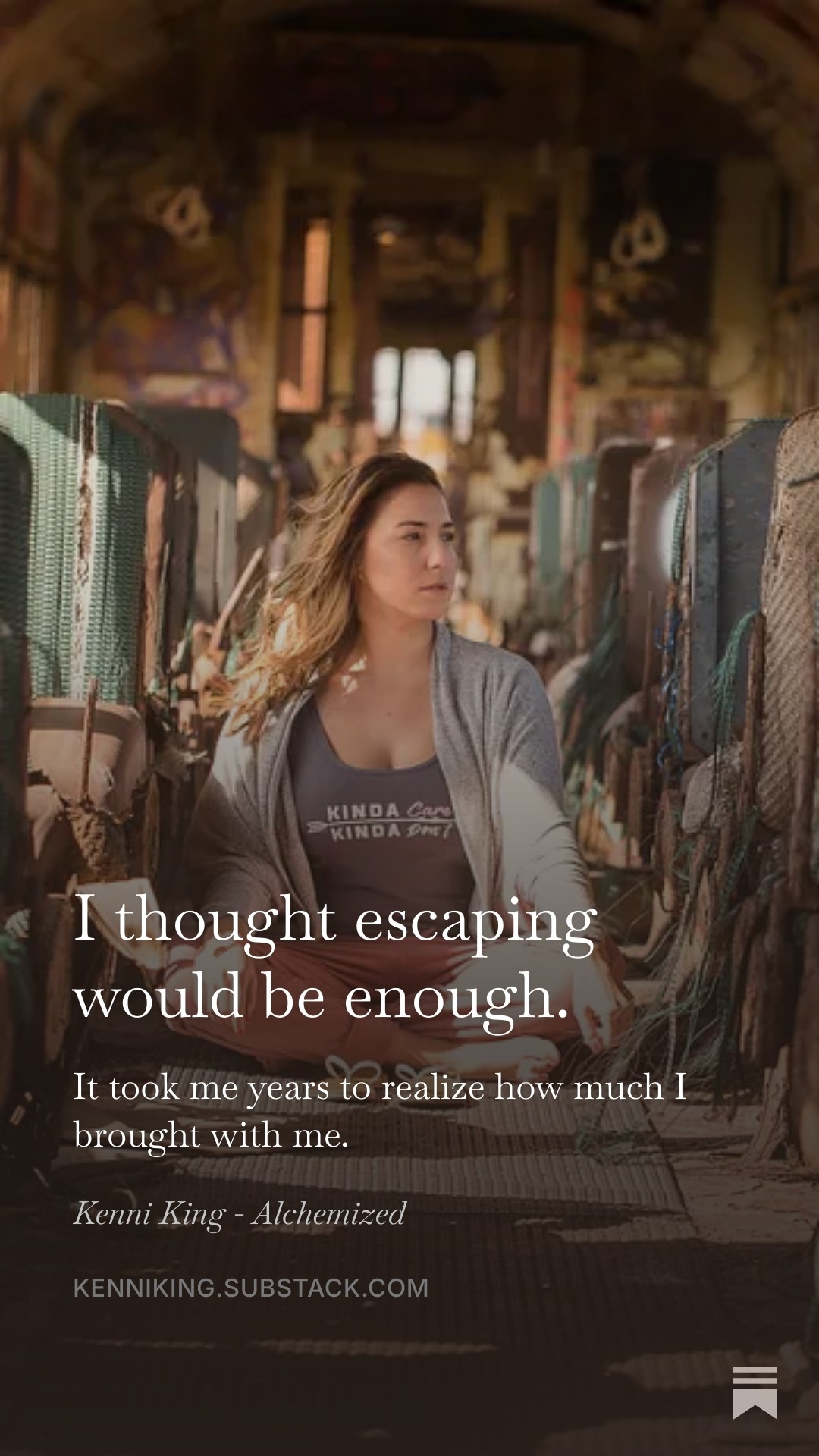 Young woman sitting on a bus, looking out the window, with graffiti-covered walls visible, and a quote about escaping.