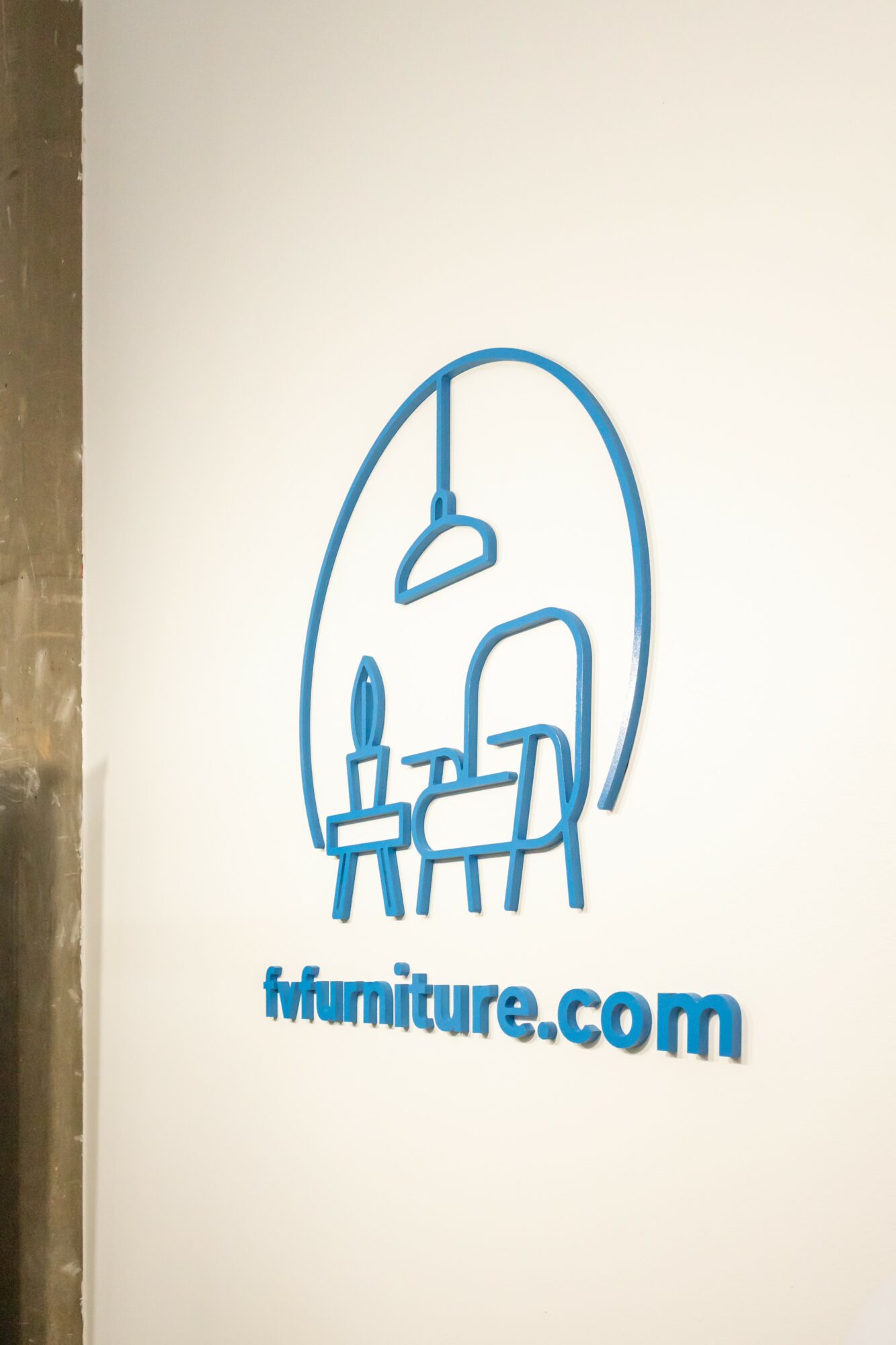 Blue line drawing of a hanging lamp, a table with a candle, and a chair, with the text 'ffurniture.com' below.