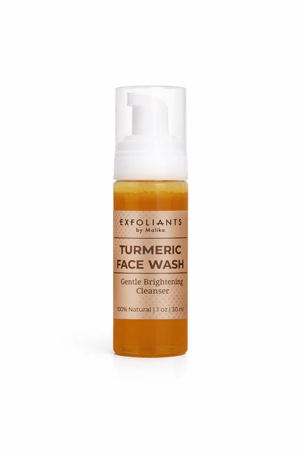 Bottle of turmeric face wash with pump dispenser, label reads 'Exfoliants by Mastic, Turmeric Face Wash, Gentle Brightening Cleanser, 100% Natural,' on a white background.