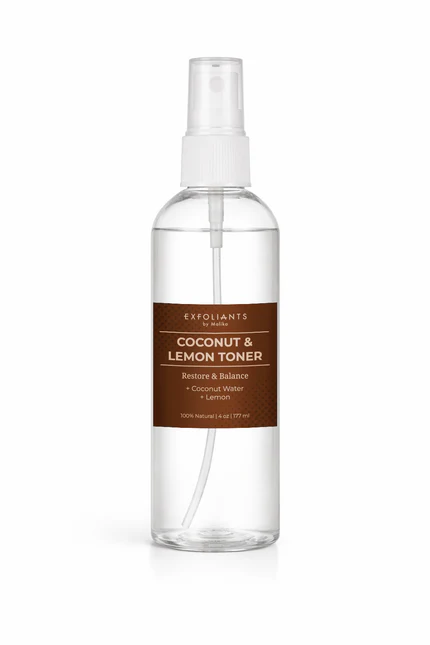 Clear spray bottle with brown label reading coconut and lemon toner, with a white spray nozzle, on a white background.