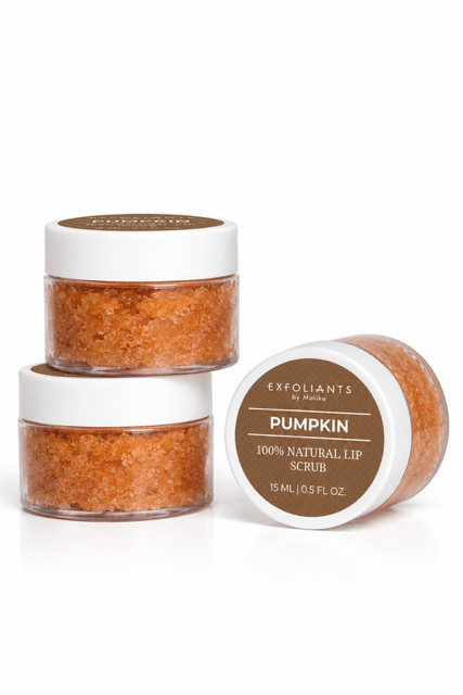 Three small jars of pumpkin exfoliant lip scrub, one jar lying on its side showing the label, two jars stacked.