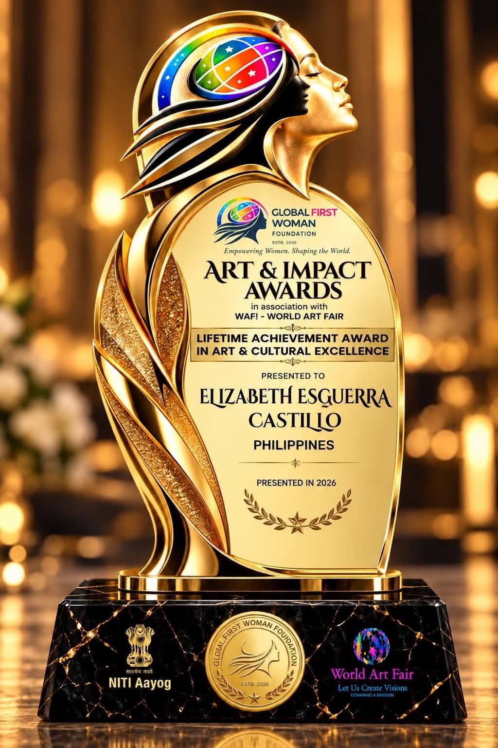 Gold award trophy with a woman's profile and colorful globe, inscribed with awards and presenter details, on a black base.