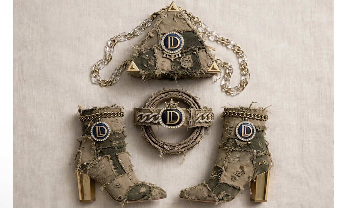 Set of three camouflage-patterned accessories with gold accents and chain details, arranged on a light background.